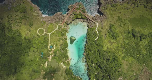 Top Down of Design Path at Azure Lake on Green Cliff Sea Shore Aerial View