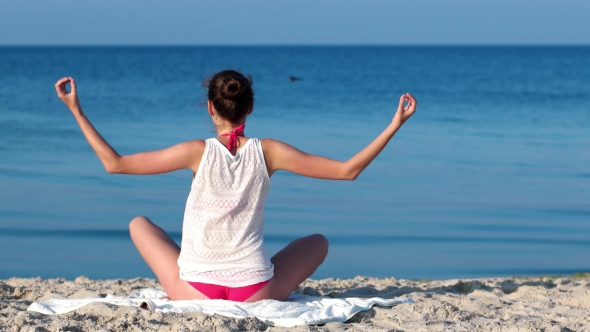 Yoga On The Beach, Calm, Tranquility, Relaxation, Sexy Girl Meditating At Sunrise On The Ocean.