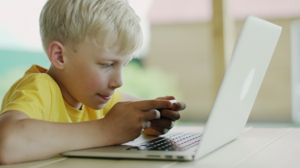 Boy With Phone And Computer