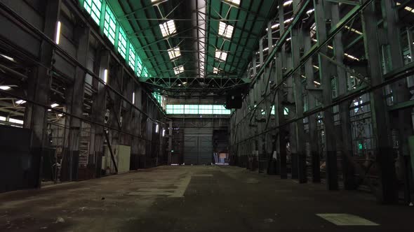 Inside a moody, green warehouse on Cockatoo Island on Sydney Harbour