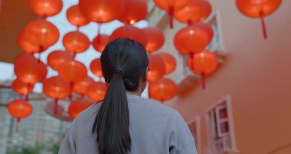 Woman look at the red lantern at night