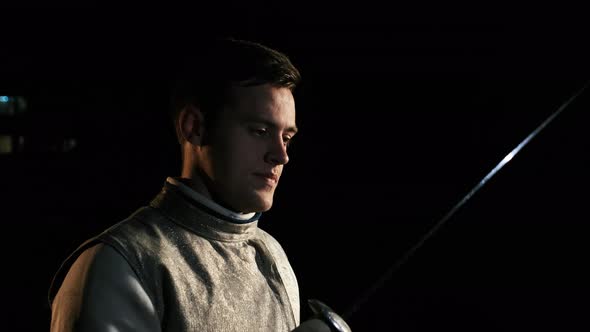 Portrait Of Young Fencer Man Looking Into Camera On The Street.