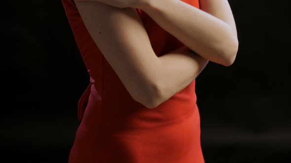 Tilt Up Of Body Of Blue Eyed Blonde Dressed In Red Dress, Looking To a Side