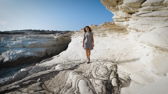 A Young Woman Walking Near By The Sea In The Long T-shirt