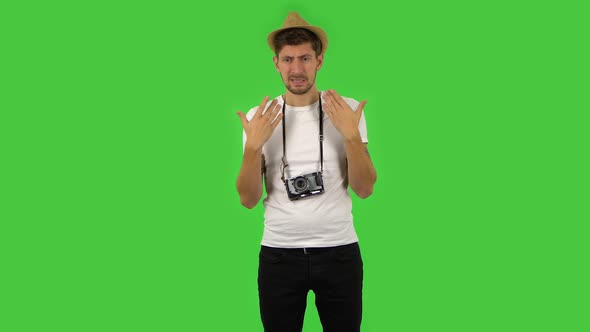 Confident Guy Is Cooling Herself By His Hand, Suffering From High Temperature Weather. Green Screen