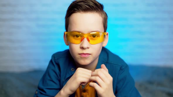 Boy in a medical glasses. Concept of quarantine and protection virus, flu, epidemic COVID-19. 
