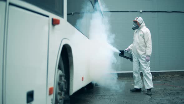 Bus Exterior is Getting Disinfected By a Sanitary Expert