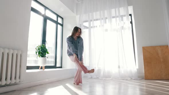Street Dancing  Young Woman in Blue Sweater Dances in Spacious Room