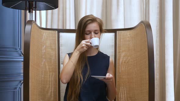 Smiling Beautiful Woman Sitting in Cafe Drinking Cup of Coffee and Relax