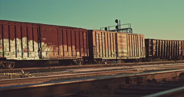 Freight Train Cargo Cars Departing Station at Empty Industrial City Railway Yard. Locomotive wagons