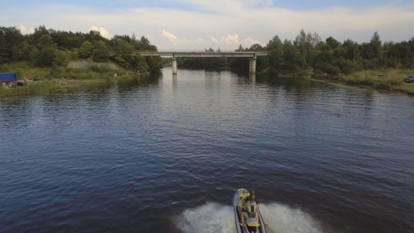 Girl And Boy On The Jet Ski In The river.Aerial Video.