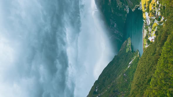 Vertical Pan Shot Geirangerfjord Norway  Geiranger In Geirangerfjorden In Sunny Summer Day