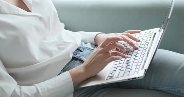 Blogger Freelancer Working on Laptop at Home