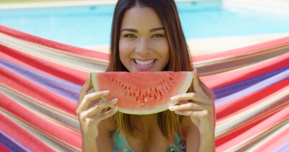 Smiling Young Woman Holding One Watermelon Slice