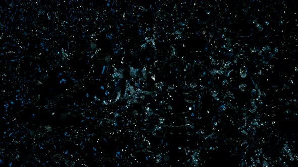 Super Slow Motion Abstract Shot of Splashing Blue Neon Water at 1000Fps alt