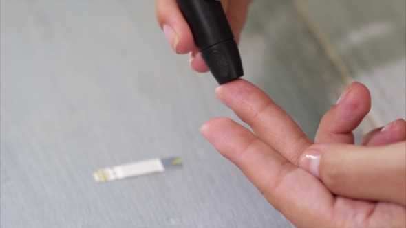  Video Of Self Testing For Diabetes Blood Sample Is Being Taken By a Stick