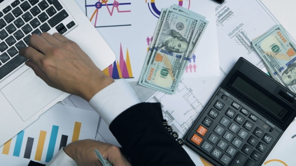 Successful Businessman Counting Money, Rubbing His Hands Happy About His Earnings, Income