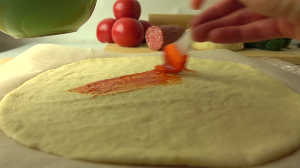 Spreading Tomato Sauce Over Dough Base. Cooking Homemade Pizza, Part Of The Set