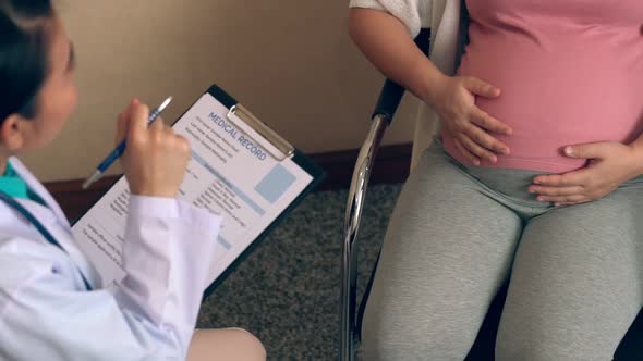 Pregnant Woman and Gynecologist Doctor at Hospital