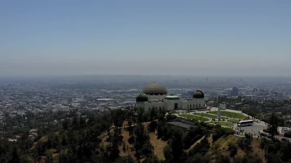 Aerial video orbiting the Griffith Observatory with Los Angeles in the background