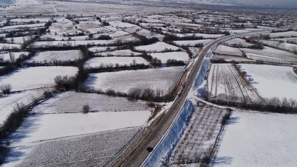 Driving Car On A Road With Snow