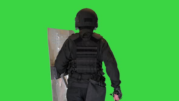 Riot Police Unit Walking with a Shield and Baton on a Green Screen Chroma Key