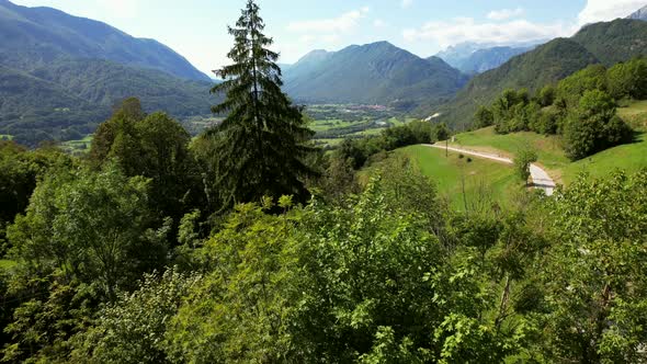 This is the beautiful countryside of Slovenia. In the background, a mountain range is visible with g