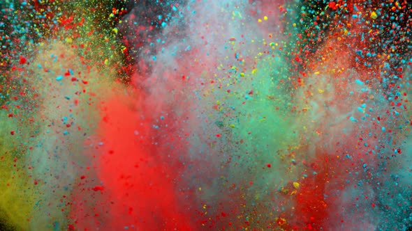 Super Slowmotion Shot of Color Powder Explosion Isolated on Black Background alt