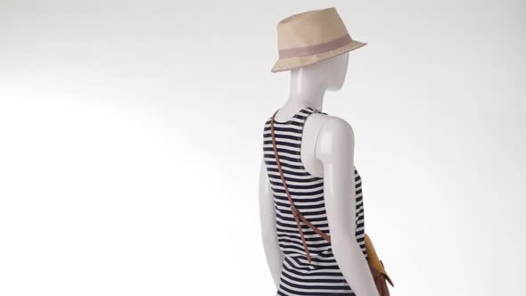 Rotating Mannequin in Striped Top.