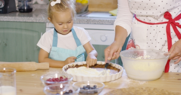 Pretty Little Girl Learning To Bake a Berry Pie