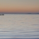 Calm Sea With a Silhouetted Rowing Boat at Sunset.  - VideoHive Item for Sale