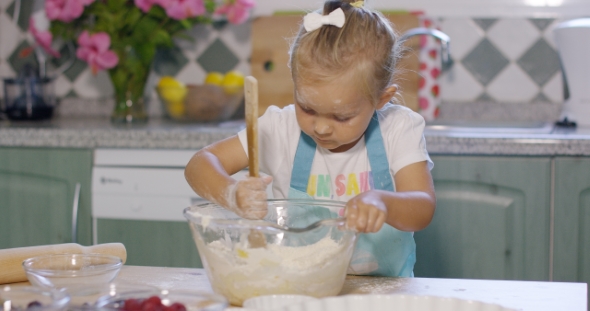 Pretty Little Girl Baking a Homemade Tart