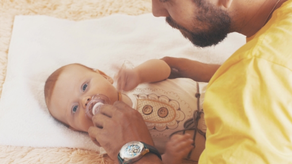 Bearded Father Lie With Little Cute Baby. Parent. Family. Communication.