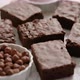 Fresh Homemade Chocolate Brownie Served with Hazelnuts and Melted Cream - VideoHive Item for Sale