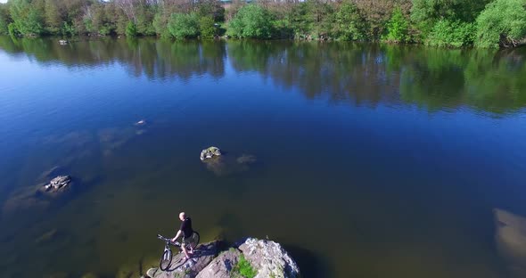 Cyclist Near River