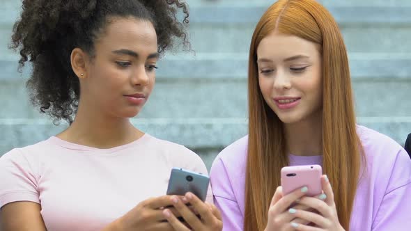 Multiracial Girls Scrolling Phone Social Networks, Teen Showing Like Rate Friend