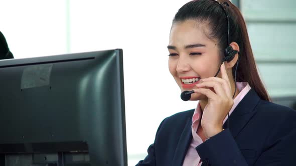 Business People Wearing Headset Working in Office