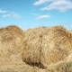 Stubble Field With Straw Bales Under Cloudy Sky. - VideoHive Item for Sale