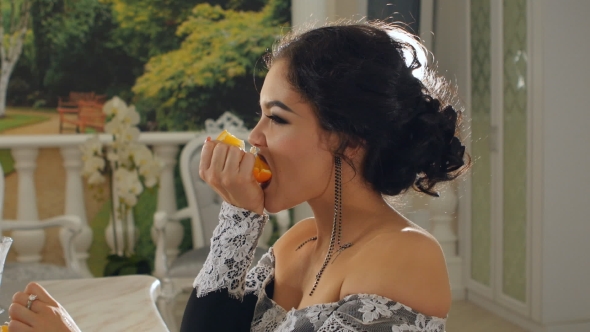 Girl Eating Messy Orange