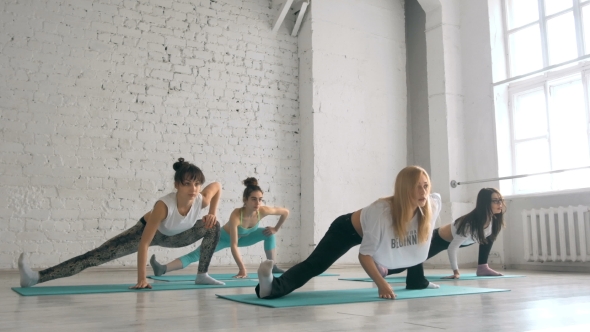Young Girls Doing Yoga, Group Of People In a Stretching Class, Healthy Lifestyle
