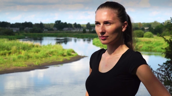 Young Beautiful Girl  On a Background Of The River