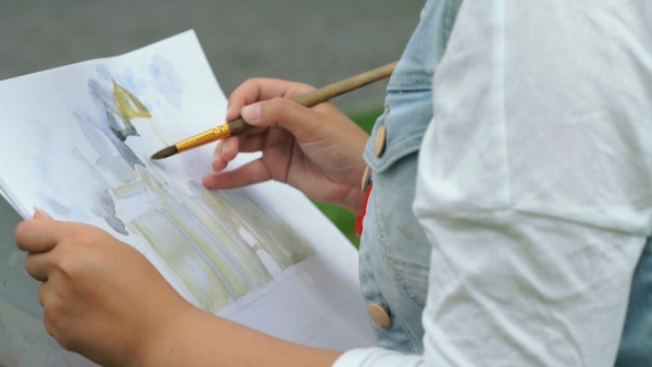 Girl Painting a Picture Of The Church Outdoors