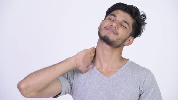 Young Stressed Bearded Indian Man Having Neck Pain