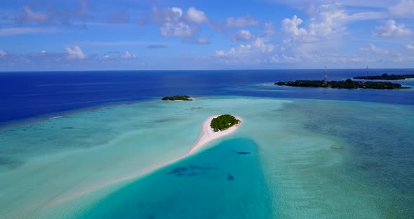 Tropical birds eye tourism shot of a white paradise beach and aqua turquoise water background in col