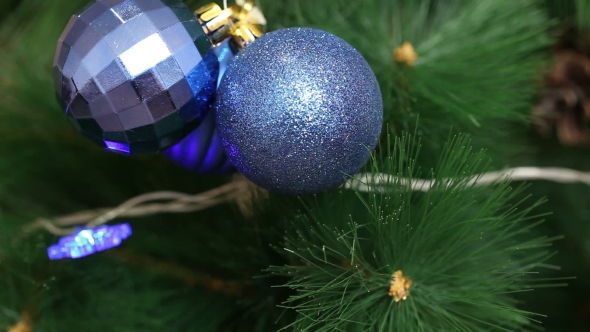 The Blue Ball Is Swinging On a Christmas Tree.