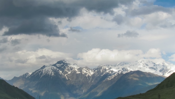 Clouds Moving Over The Georgian Mountains. Mount Kazbek. 