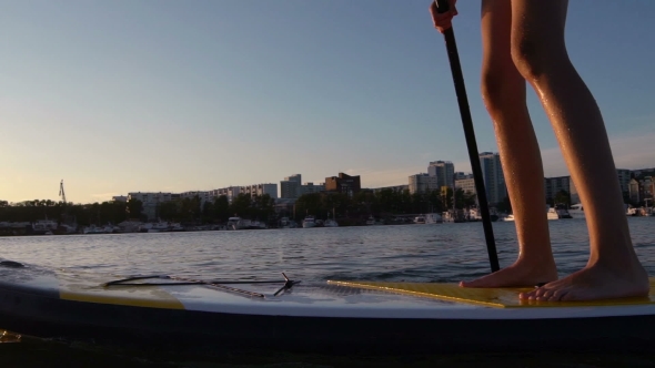 Beautiful Woman On Stand Up Paddle Board. SUP.