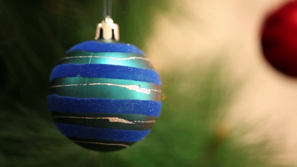 The Blue Ball Is Swinging On a Christmas Tree