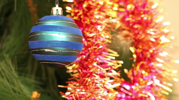 The Blue Ball Is Swinging On a Christmas Tree