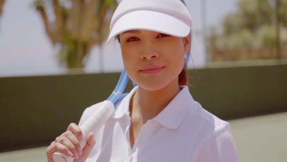 Female Tennis Player With Racket Wearing Sun Visor